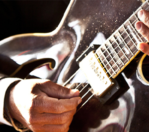 Hands playing guitar