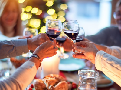 Friends touching wine glasses