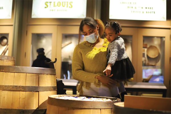 Woman and child exploring museum